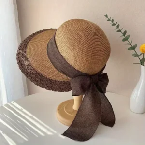 Chapeau de paille à large bord avec nœud décoratif